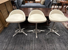 Load image into Gallery viewer, Three Swivel Counter Stools with Metal Base & Foot Rest in Cream Faux Leather Vinyl from Cumberland
