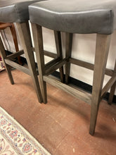 Load image into Gallery viewer, Pair of "Vail Saddle" Barstools in Greyland Maple with "Pewter" Leather Seats from Bassett Furniture