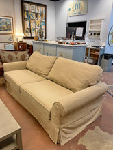 Load image into Gallery viewer, Tan Slip Covered Sofa from Pottery Barn
