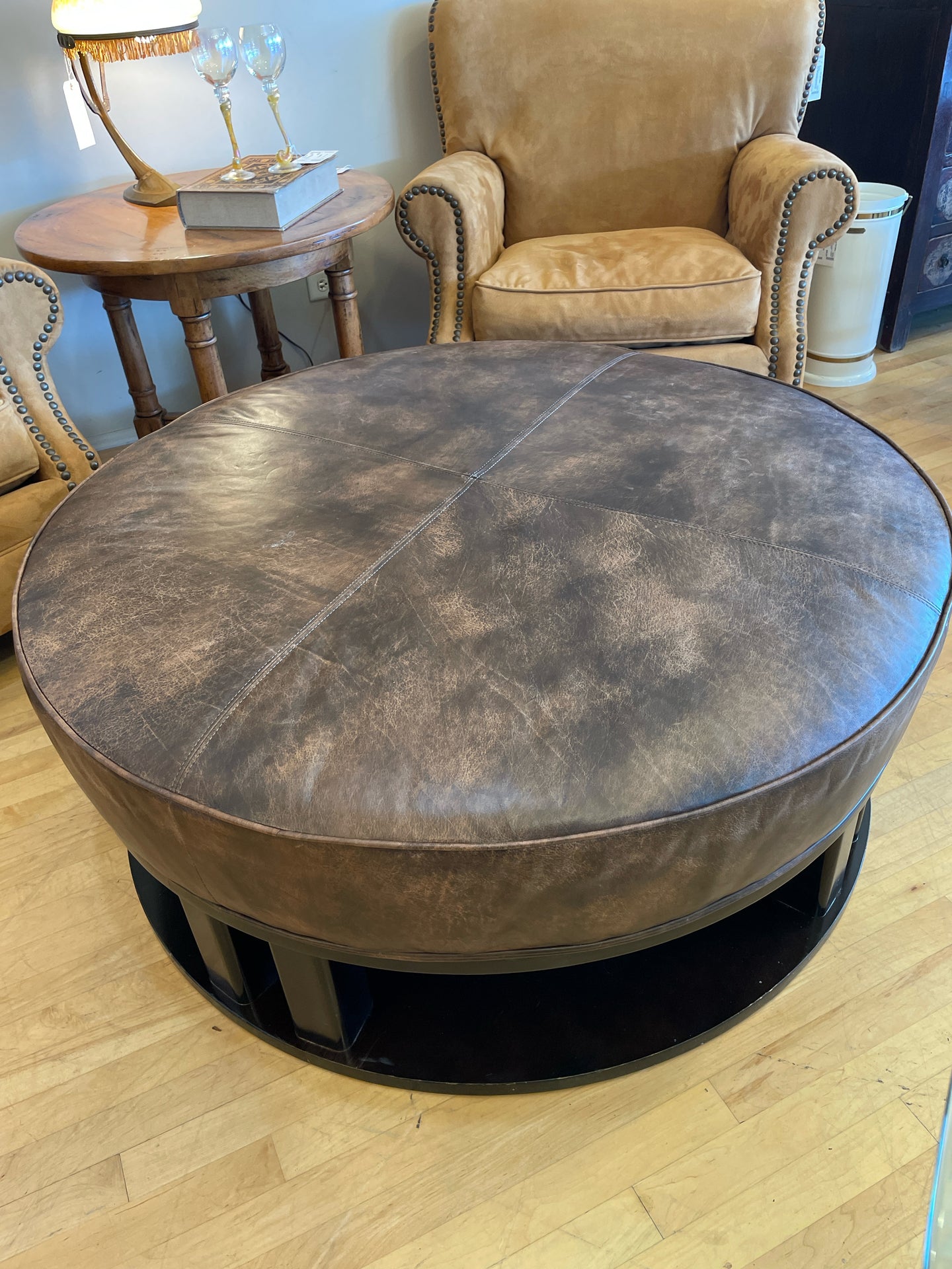 Round Leather Ottoman with  Black Wood Base from Century Furniture Co.