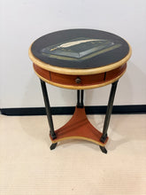 Load image into Gallery viewer, Round one Drawer Occasional Table with Painted Book Accent
