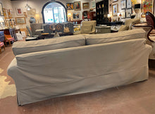 Load image into Gallery viewer, Tan Slip Covered Sofa from Pottery Barn
