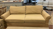 Load image into Gallery viewer, Tan Slip Covered Sofa from Pottery Barn
