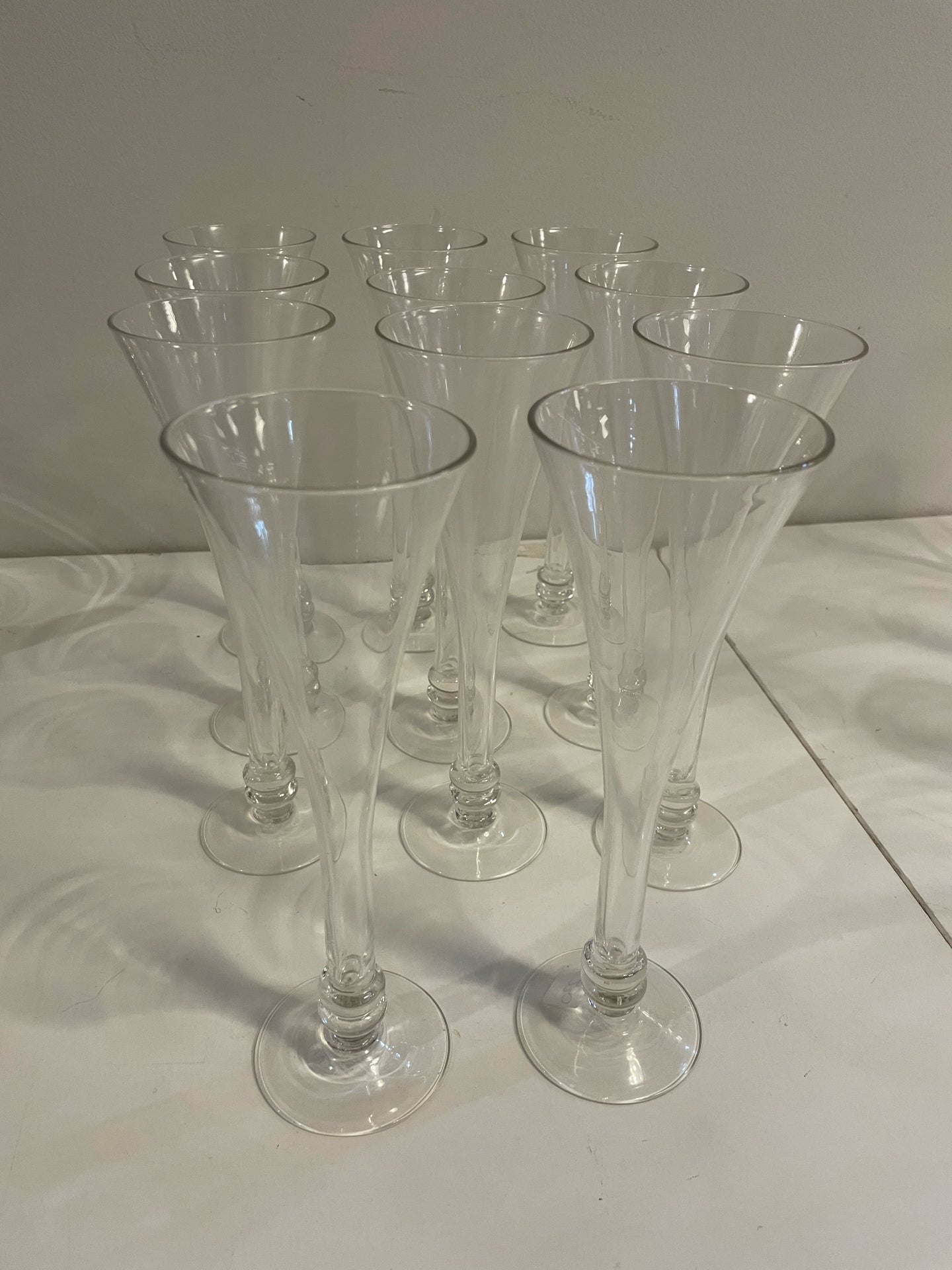 Eleven Champagne Glasses