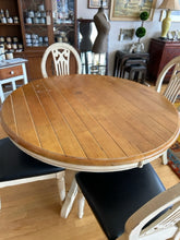 Load image into Gallery viewer, Round Pedestal Dining Table &amp; 4 Distressed Wood Chairs with Black Leather Seats
