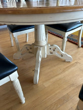 Load image into Gallery viewer, Round Pedestal Dining Table &amp; 4 Distressed Wood Chairs with Black Leather Seats

